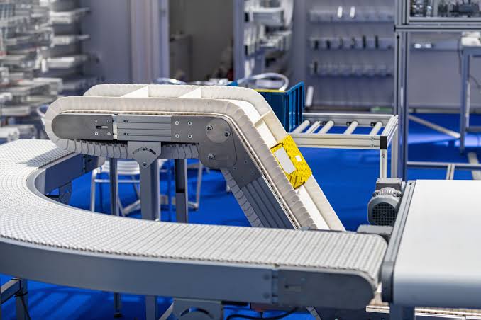 Industrial conveyor equipment installed inside a modern factory