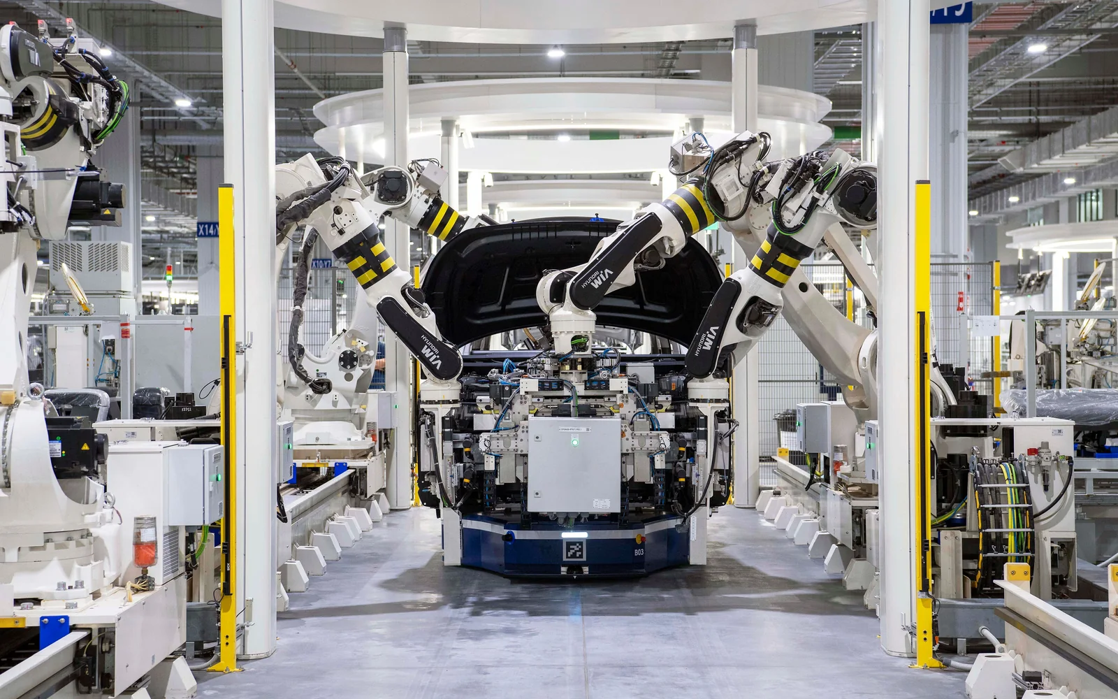 Industrial robots integrated into an automotive manufacturing process