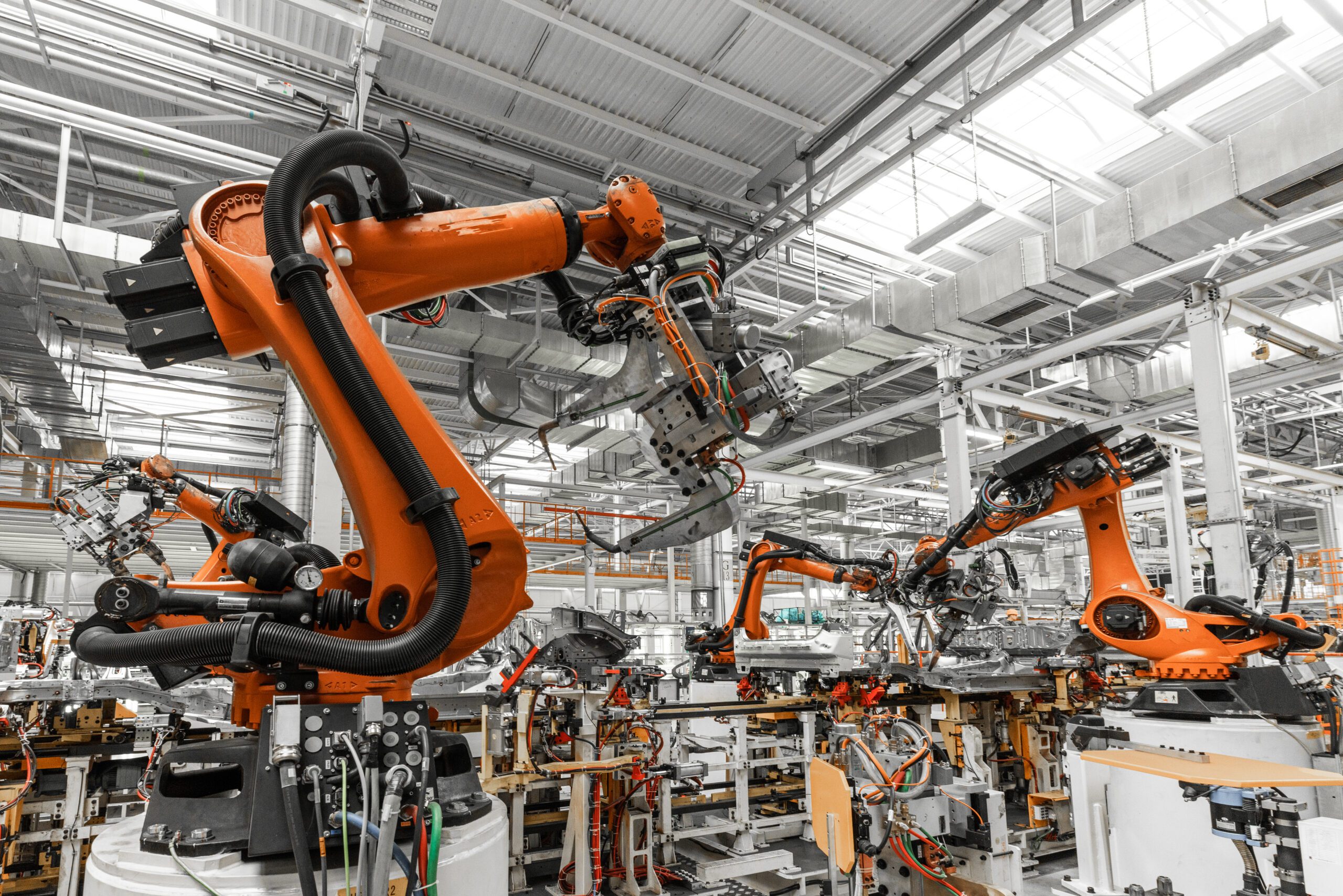 Photo of automobile production line. Welding car body. Modern car assembly plant. Auto industry Photo of automobile production line. Welding car body. Modern car assembly plant. Auto industry.